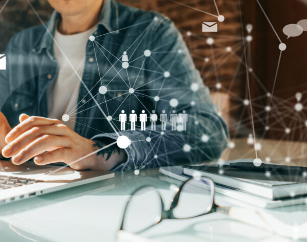Male hands with laptop. Man working remotely at home. Concept of Close-up photo of male hands with laptop. Man working remotely at home. Concept of networking or remote work. Global business network.